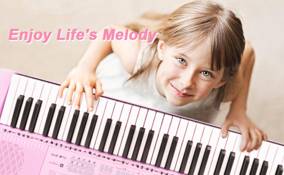 A girl is playing the electronic keyboard.